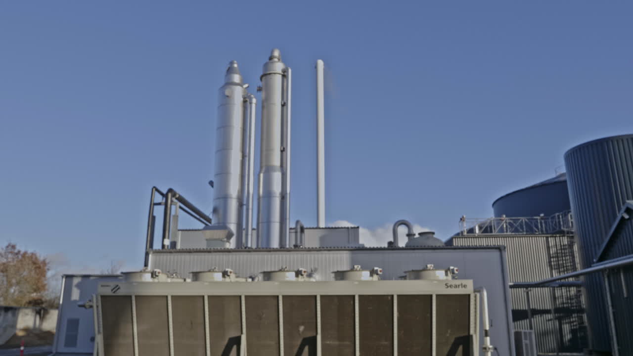 Detailed view of a part of a modern biogas installation in rural Denmark, showing clean energy infrastructure producing renewable gas from organic waste