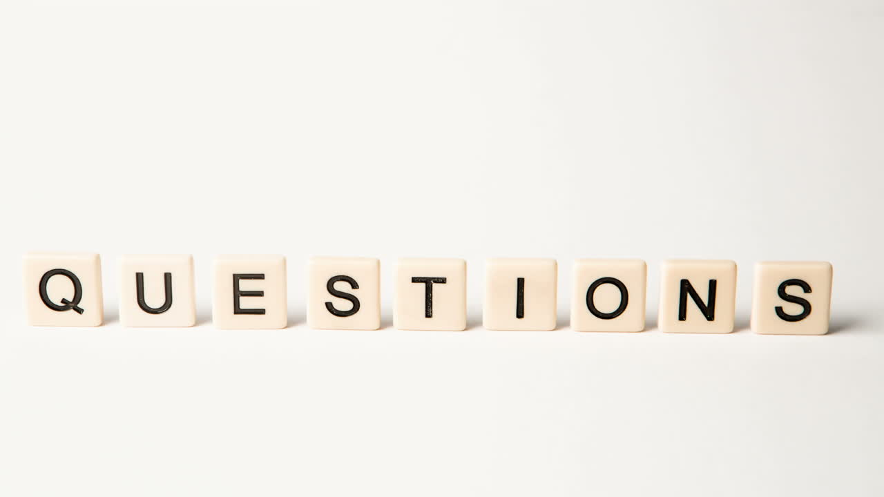 Letter pieces spelling answers and questions standing up and moving over