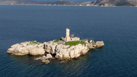 aerial beautiful view of lighthouse with seagulls in corfu greece