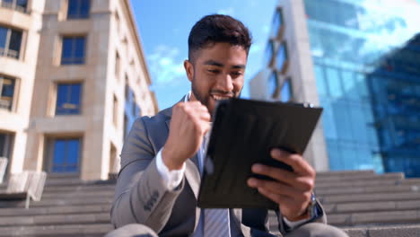 Man,-tablet-and-celebrate-success-outdoor-in-city