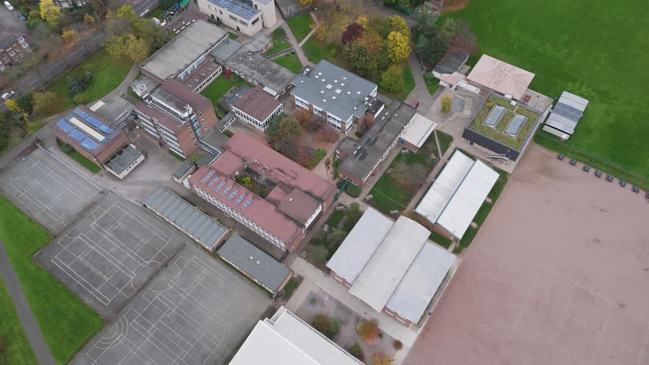 Dynamic pull-out shot revealing full campus expanse of Ellen Wilkinson School, Ealing, London, UK, October 2024