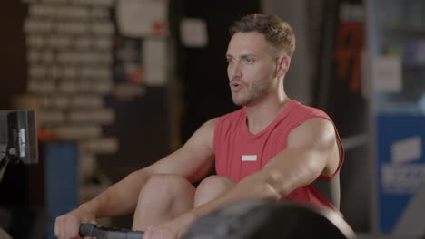man exercising on rowing machine