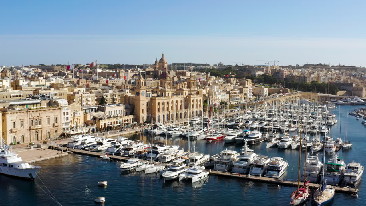 Birgu Malta Waterfront With Yachts Moored In The Marina - aerial drone shot
