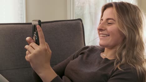 young woman video calling on her cell phone