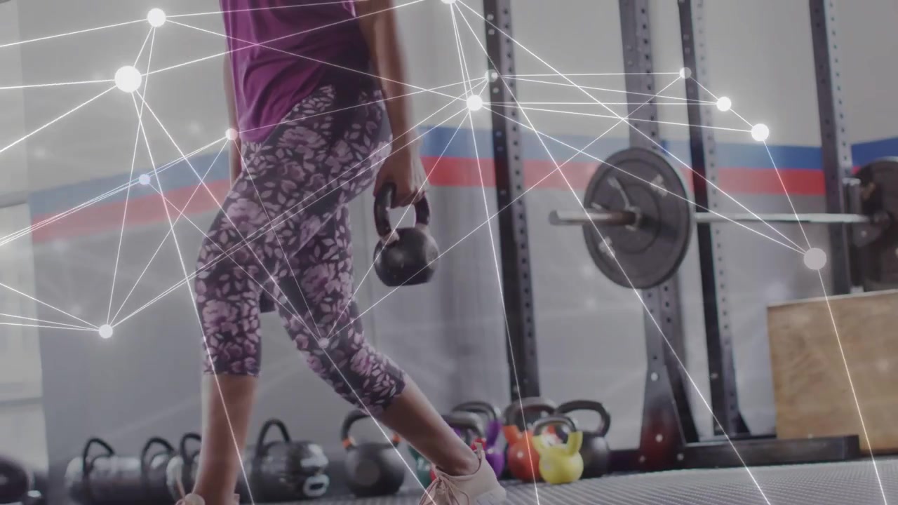 Woman doing kettlebell lunges, starting low, training lower body while overlay mapping movement