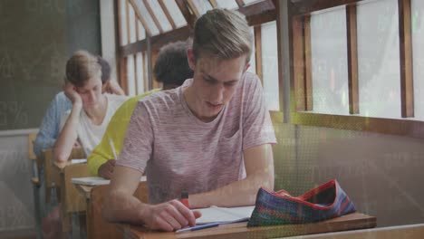 animation of trading board and graph moving over caucasian teenage boy studying in classroom