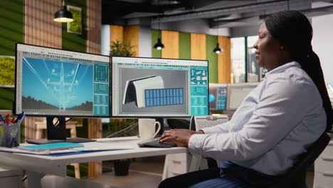 smiling engineer in office pleased after developing innovative solar device
