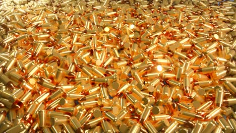 seamless 4k loop animation of a pile of bullets lying in a mess.