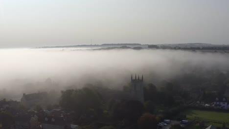 Drone-Shot-Approaching-Islip-Church-In-Mist-02