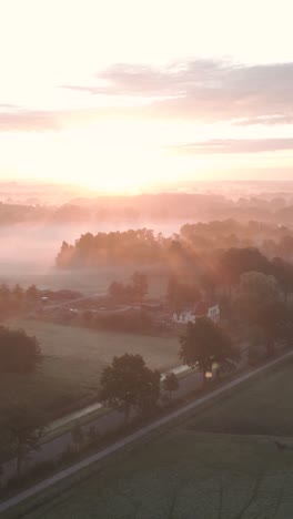 misty sunrise over dutch countryside