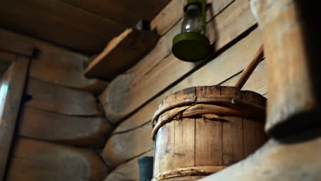 antique wooden barrel in a rustic log cabin interior