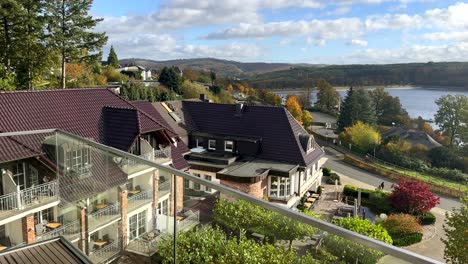 Panorama-view-of-Sorpesee-Sorpe-Dam-with-green-hills-during-sunny-day--View-from-luxury-German-Seegarten-Hotel-in-Germany