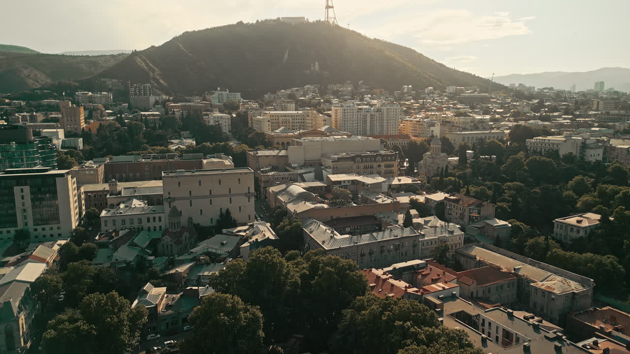Aerial View of Tbilisi, Georgia, with Cityscape and Mountains