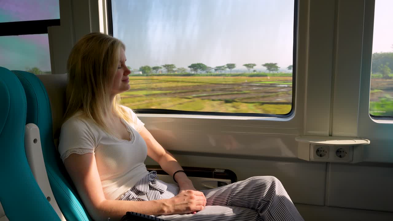 Tourist Woman Riding Business Class on Indonesian KAI Train
