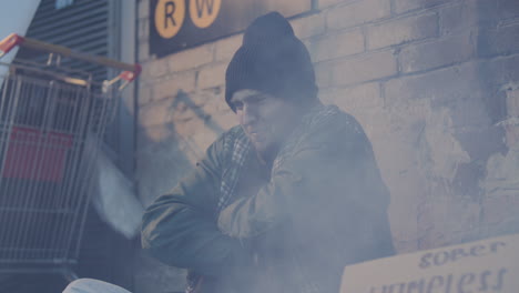homeless man shivering from cold and coughing as begging on street