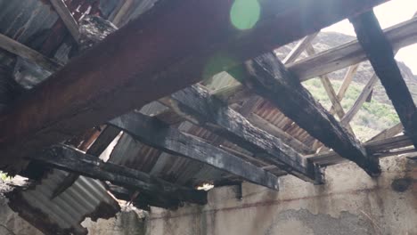 damaged building with a collapsed roof