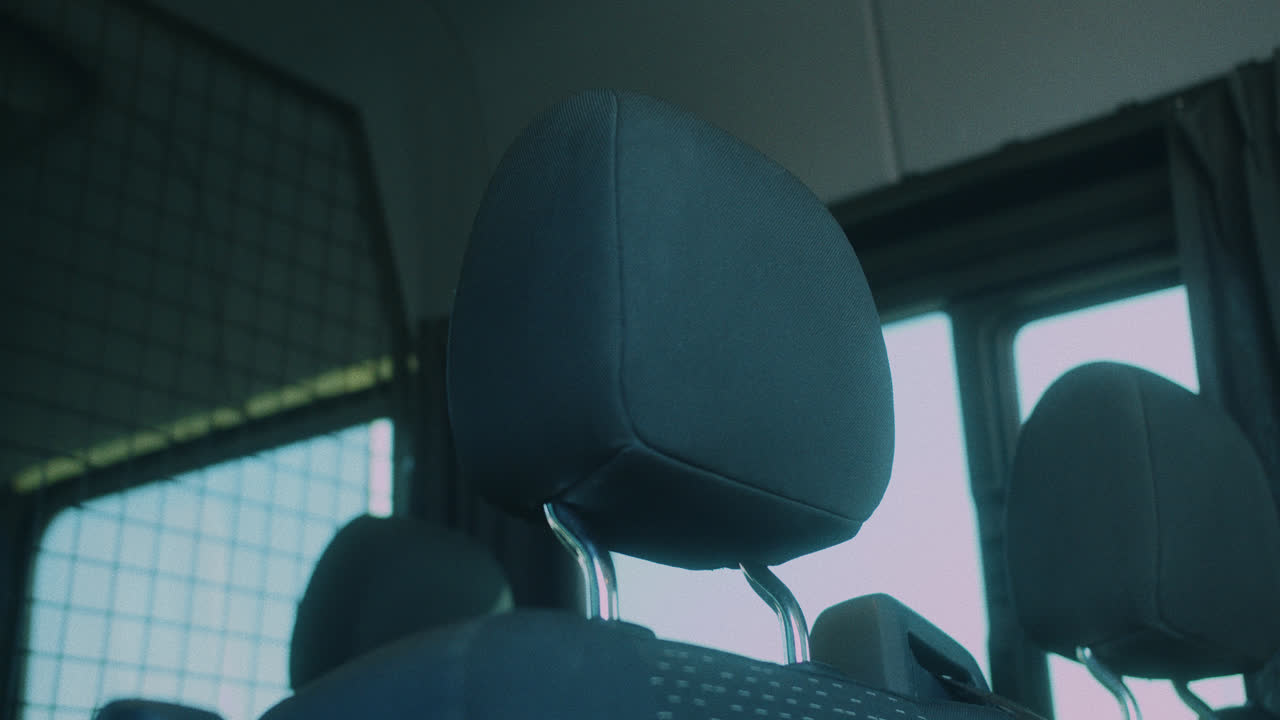 Amazing slow motion shot of the seats inside a very large, elegant and modern black van Mercedes for transporting musical bands in Madrid.