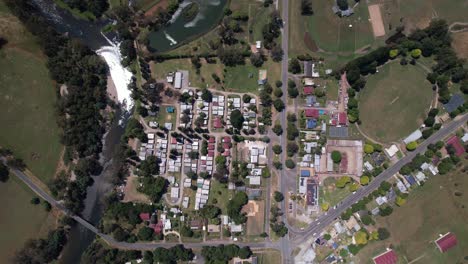 Aerial-of-Thornton-small-town-next-to-a-flowing-river-and-farmland