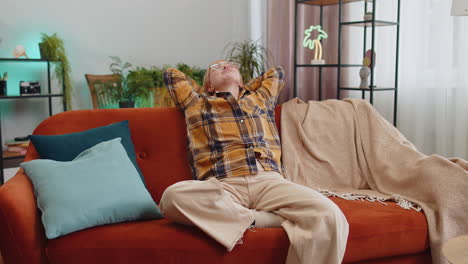 tired lazy woman enjoy relaxing on home sofa resting napping after hard working day, closed her eyes