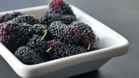 fresh mulberries in a white bowl