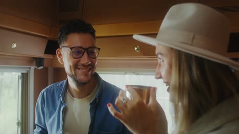 couple enjoying a drink in their rv