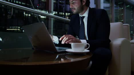 middle eastern businessman working with laptop smart phone