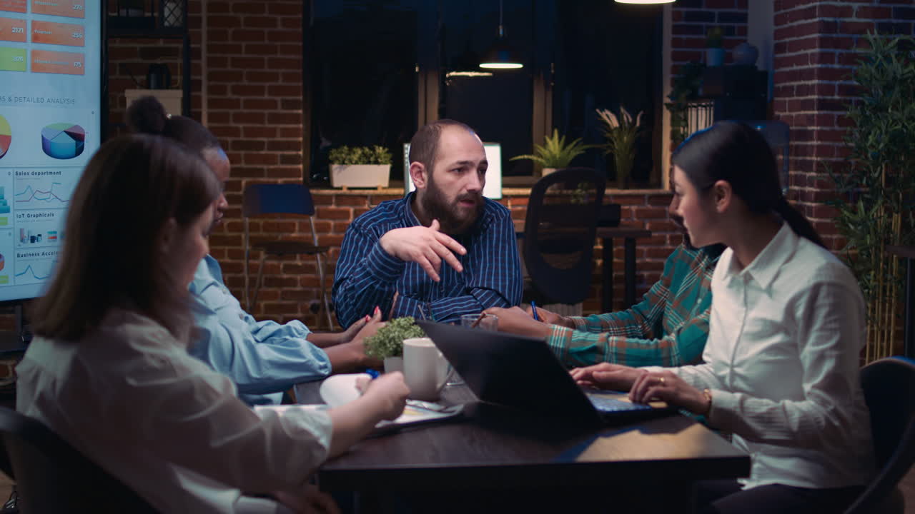 Diverse coworkers brainstorming, planning strategy in business meeting