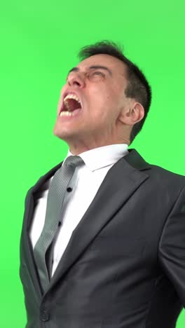 businessman yelling and screaming on green screen