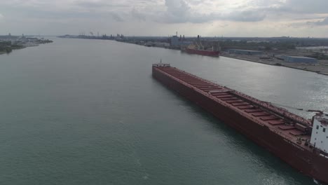 this video is of an aerial of large tanker ships in the detroit river near downtown detroit