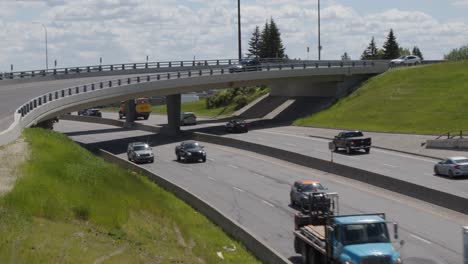 Timelapse-of-traffic-driving-on-Glenmore-Trail-at-overpass-in-Calgary