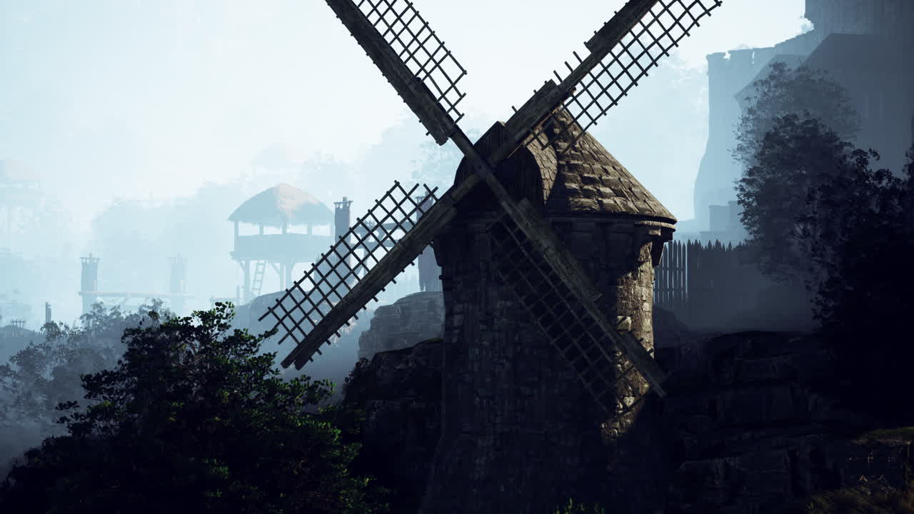 풍차 가 있는 안개 가 가득 한 중세 마을