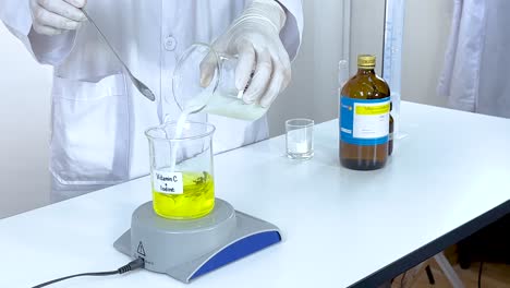 scientist conducts iodine clock reaction using vitamin c and starch in a laboratory setting with controlled lighting