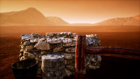 viejo pozo de agua de piedra en el desierto
