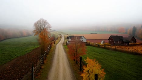 aerial view of a foggy countryside farm