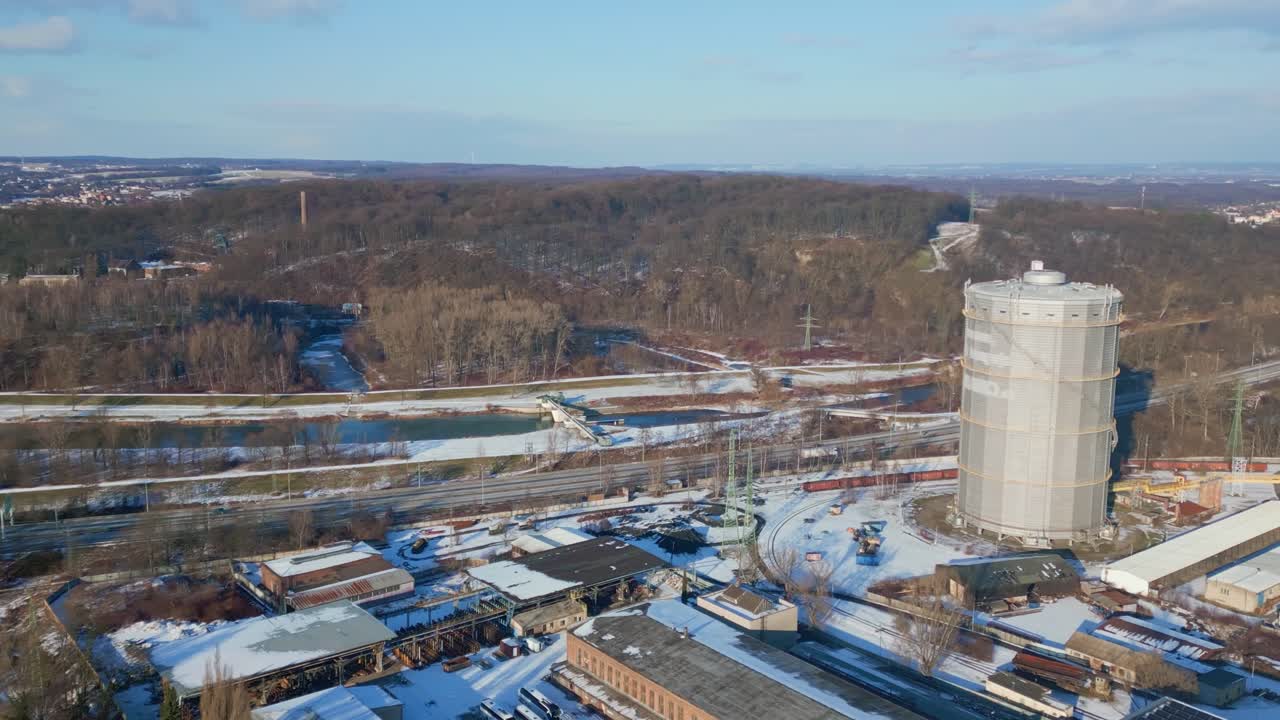 Aerial shows Privoz industrial coking plant facility amid winter landscape Ostrava