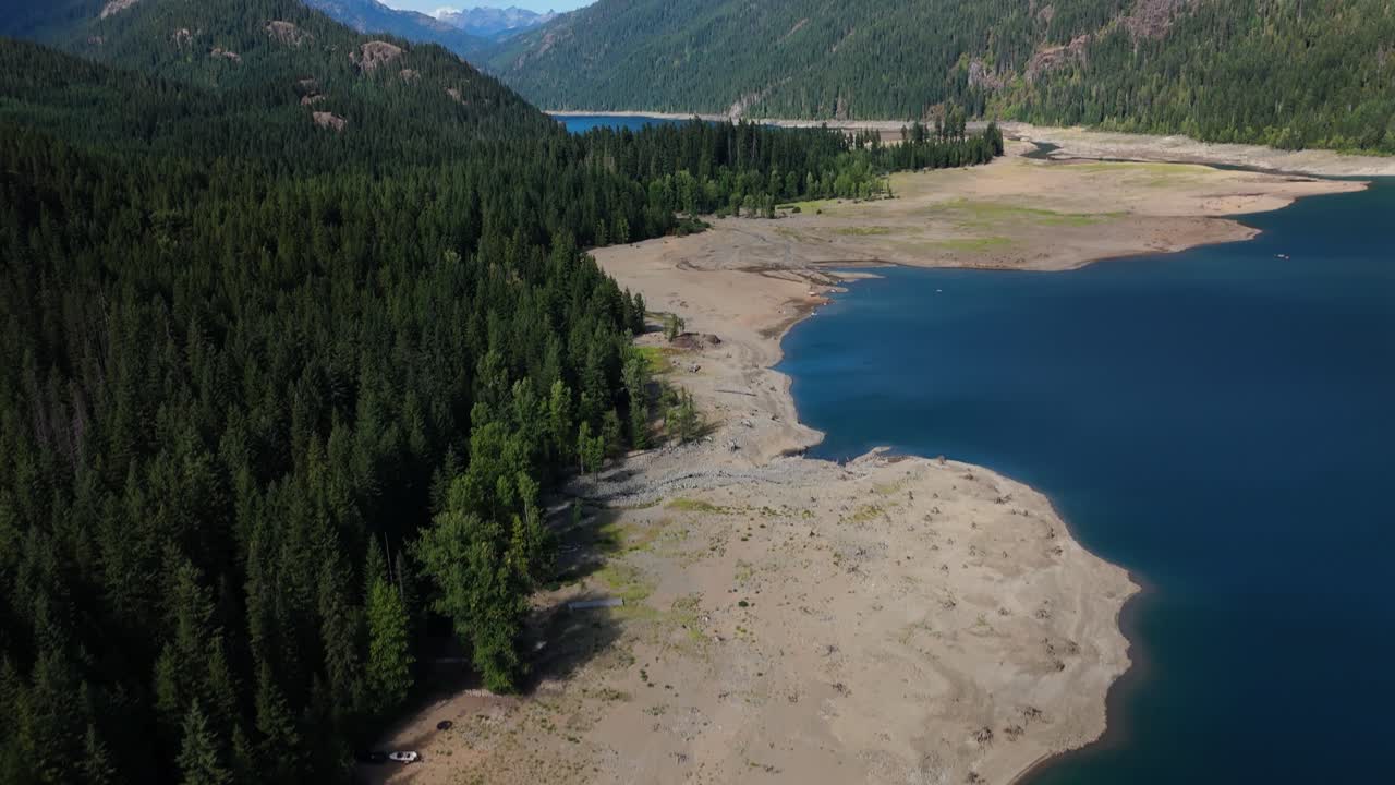 Aerial View of Lake Surrounded by Mountains and Forest