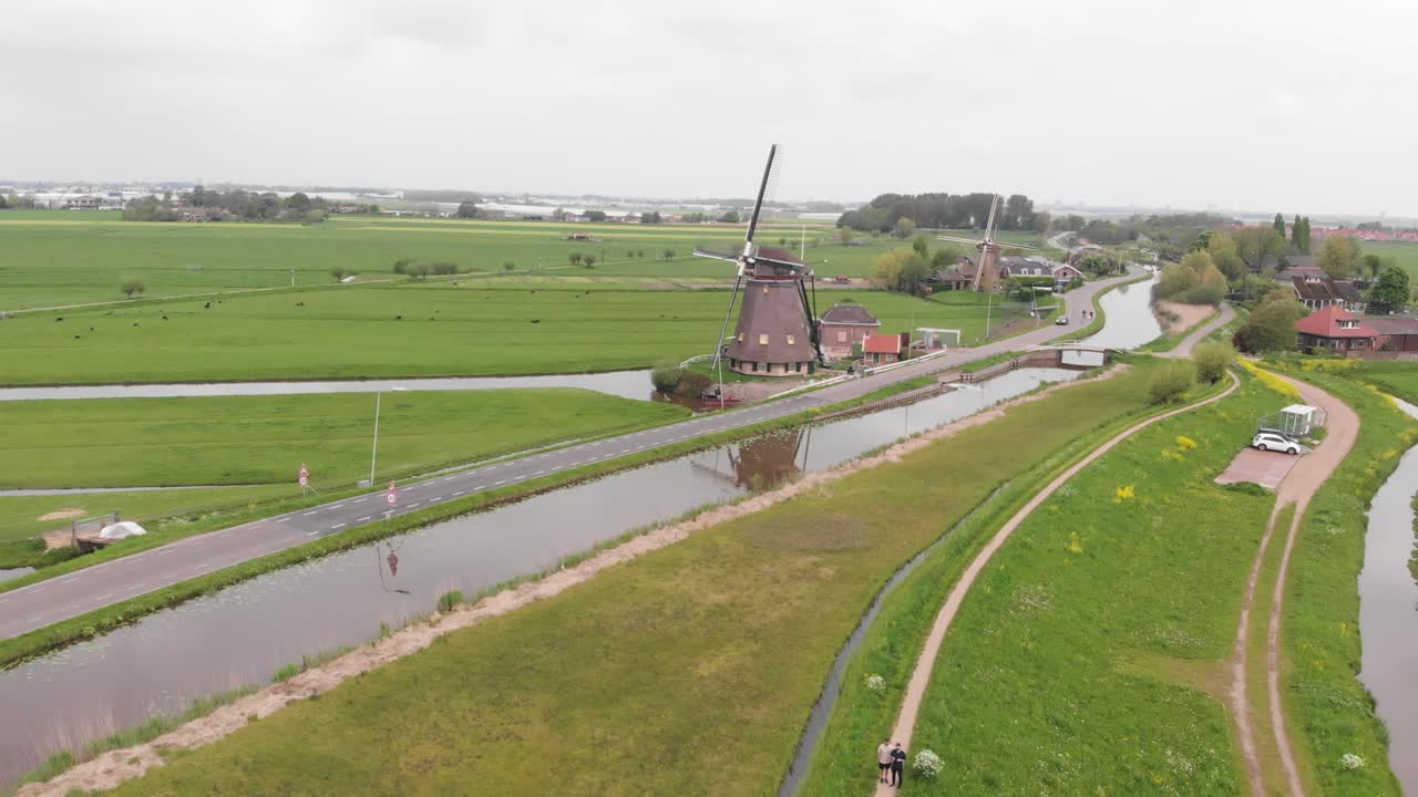 A drone captures windmills standing tall in the Netherlands.