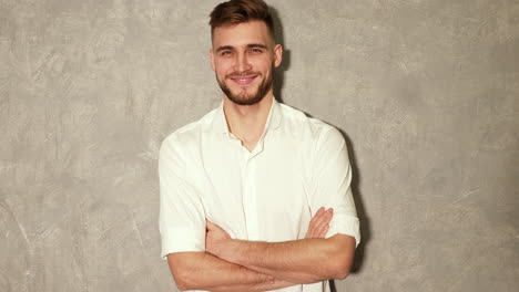 attractive bearded stylish young man looking at camera