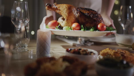 Woman-serving-a-festive-Christmas-turkey-on-the-table