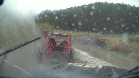 off-road vehicle driving through mud