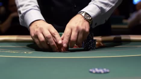 a close-up view of a skilled player's hands strategically organizing chips at a poker table during a high-stakes game, capturing the intensity of the moment