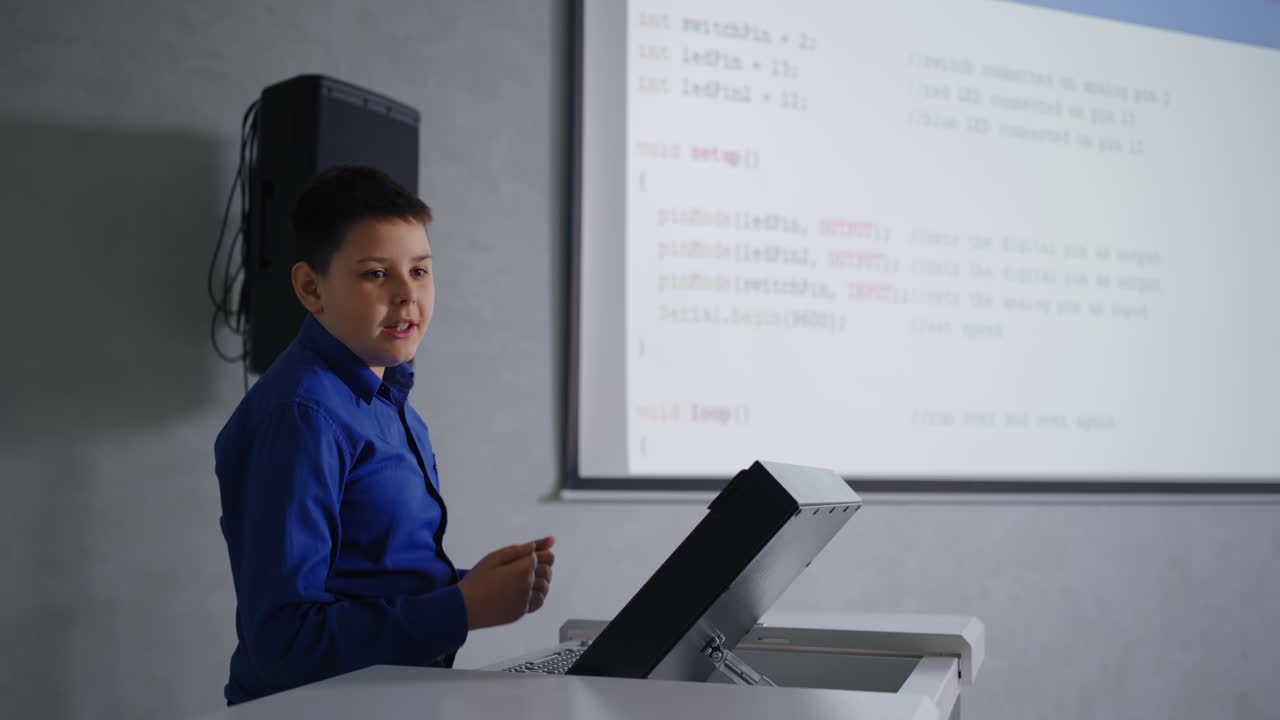Boy giving a presentation about coding