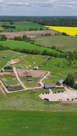 green horse pastures and stables - drone view of ranch life