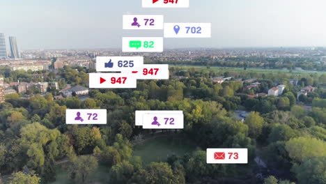 animation of social media icons falling against aerial view of cityscape