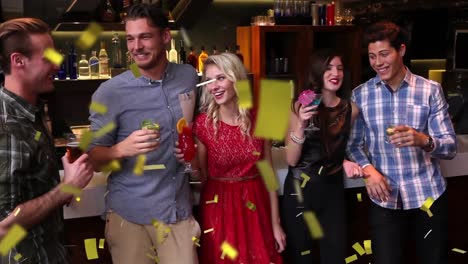 Animation-of-confetti-falling-over-happy-group-of-friends-having-fun-at-party