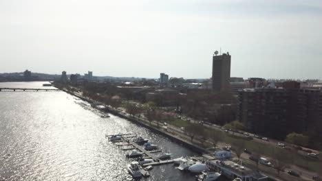 contemporary buildings and bustling streets at the bay of charles river, view in cambridge, massachusetts - aerial drone - out of focus