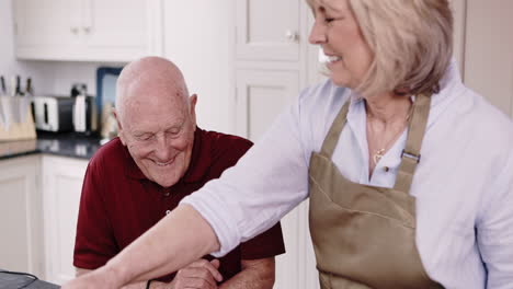 elderly couple cooking together in the kitchen