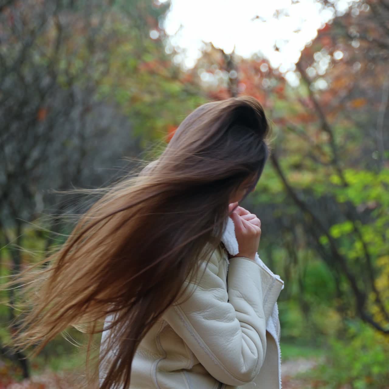 Lifestyle nature walking. Cheerful young lady in golden autumn park