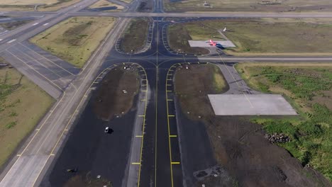 above airport taxiway on clear summer day, airfield concrete tarmac