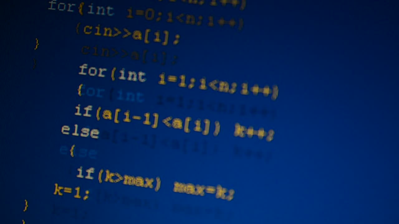 Source code on the monitor screen. Source code